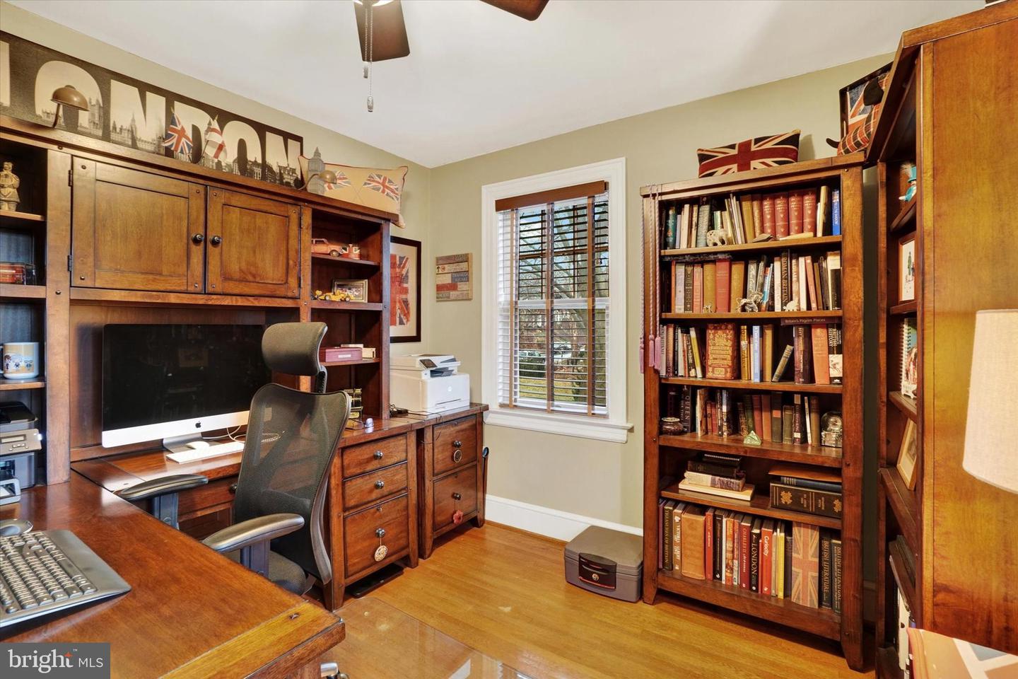 First-floor study at 185 Peyton Road with built-in desk, bookshelves, and hardwood floors