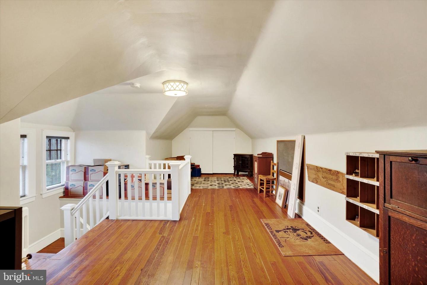 Third floor at 185 Peyton Road showing full open space with dormer windows and built-in storage