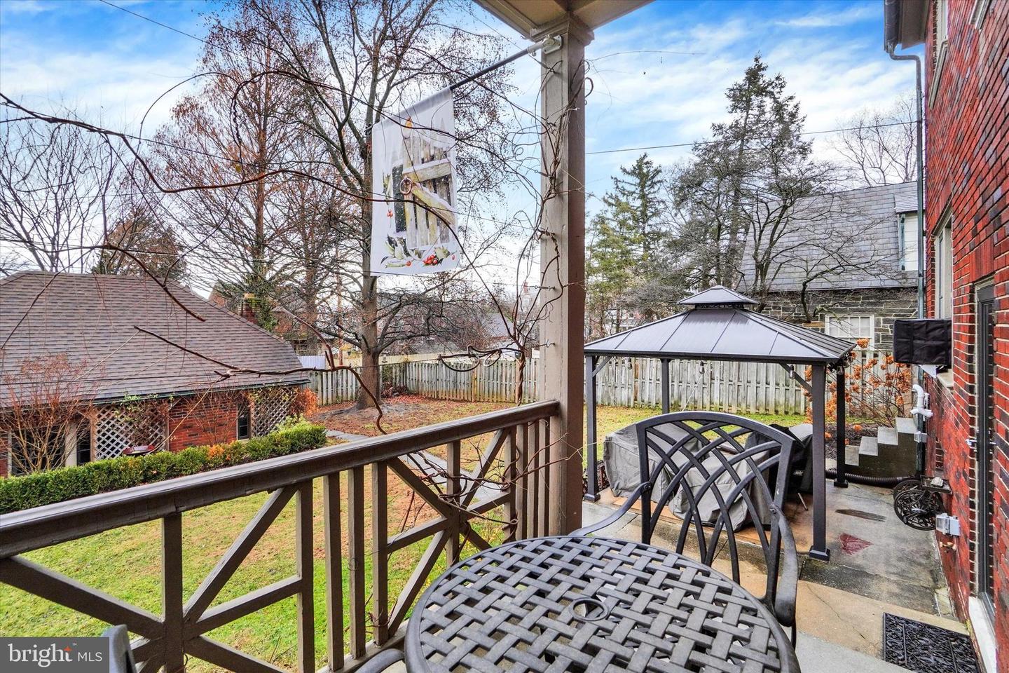 Back porch at 185 Peyton Road overlooking the rear yard and patio with gazebo