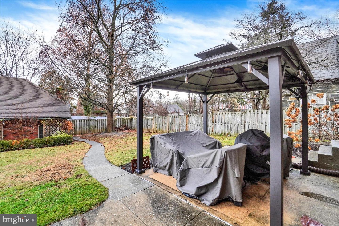 Patio area at 185 Peyton Road with gazebo and walkway to detached garage